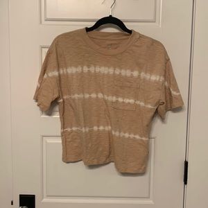 tan short sleeve crop top tee. tie-dye pattern with front pocket